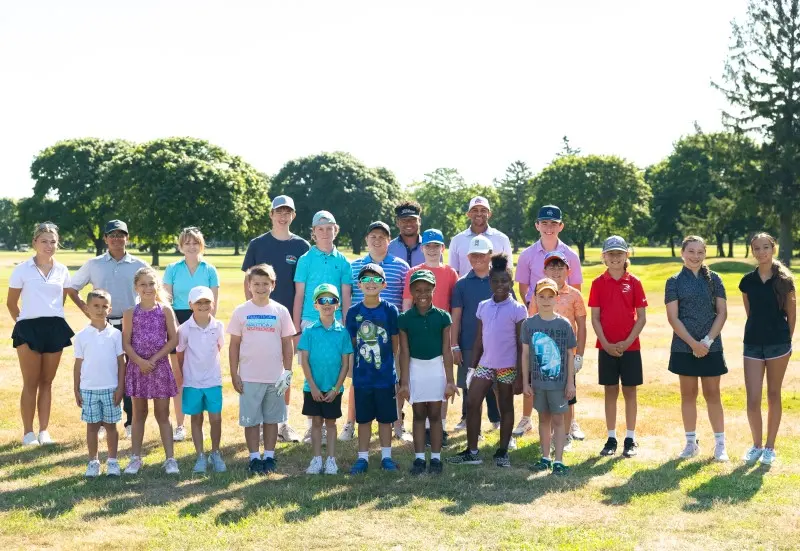 A long line of junior campers on the range