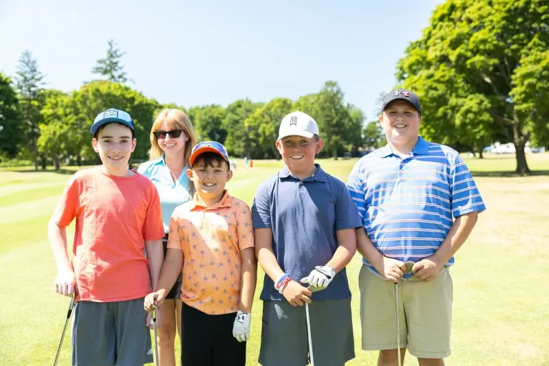 Juniors and a coach on the course