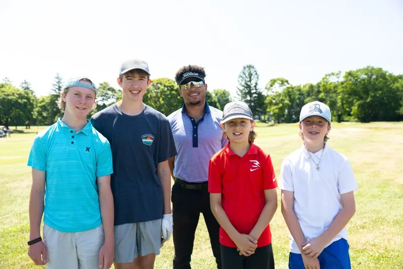 Teenage players posing together