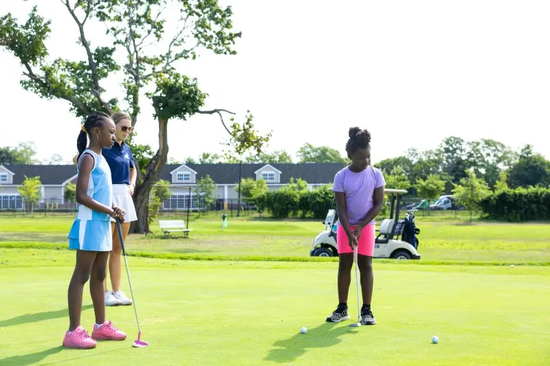 Junior girls on the putting green