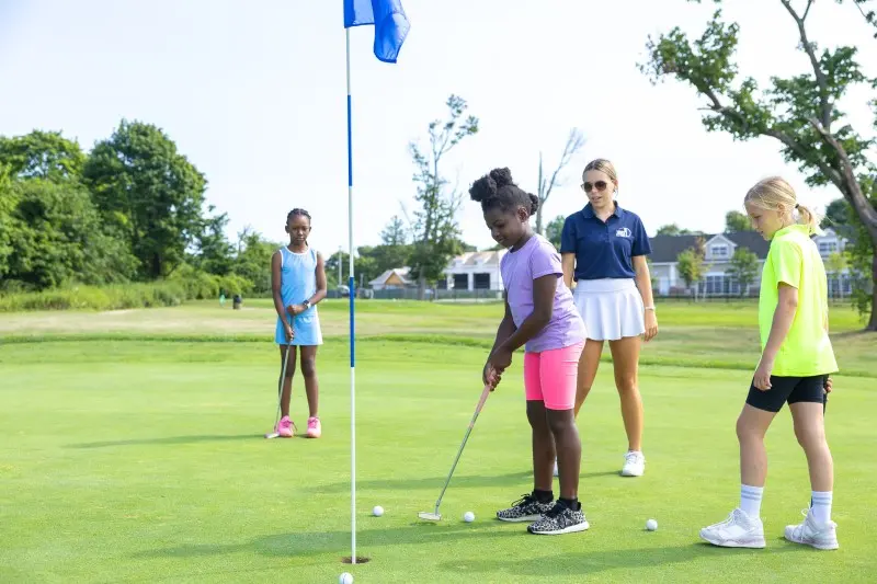 Juniors putting beside the flagstick
