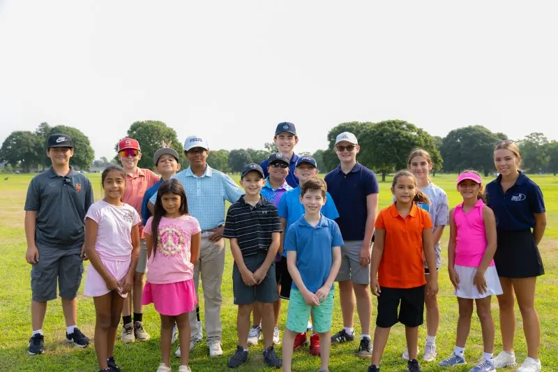 Junior campers and coaches on the range