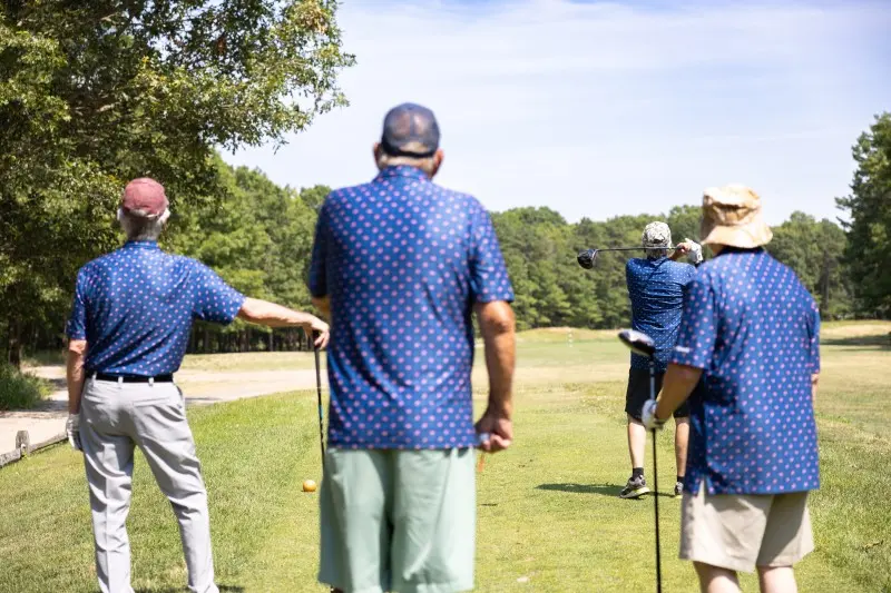 An instructor talks with veterans on the range